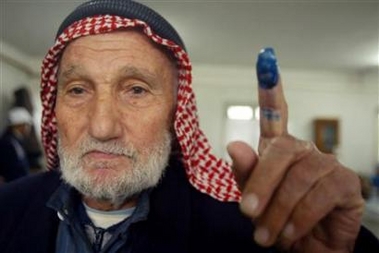 An elderly Palestinian man shows his finger after voting at a polling station in the Khan Younis refugee camp south of Gaza Strip.