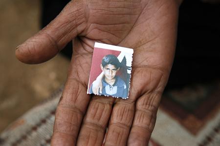 Hammad&rsquo;s aunt or mother holds the last remaining photo of him in the palm of her hand.