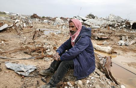 Hammad&rsquo;s father Barrak Salem Salaam Silmiya, surrounded by the carcasses of his livestock and the remains of his home.